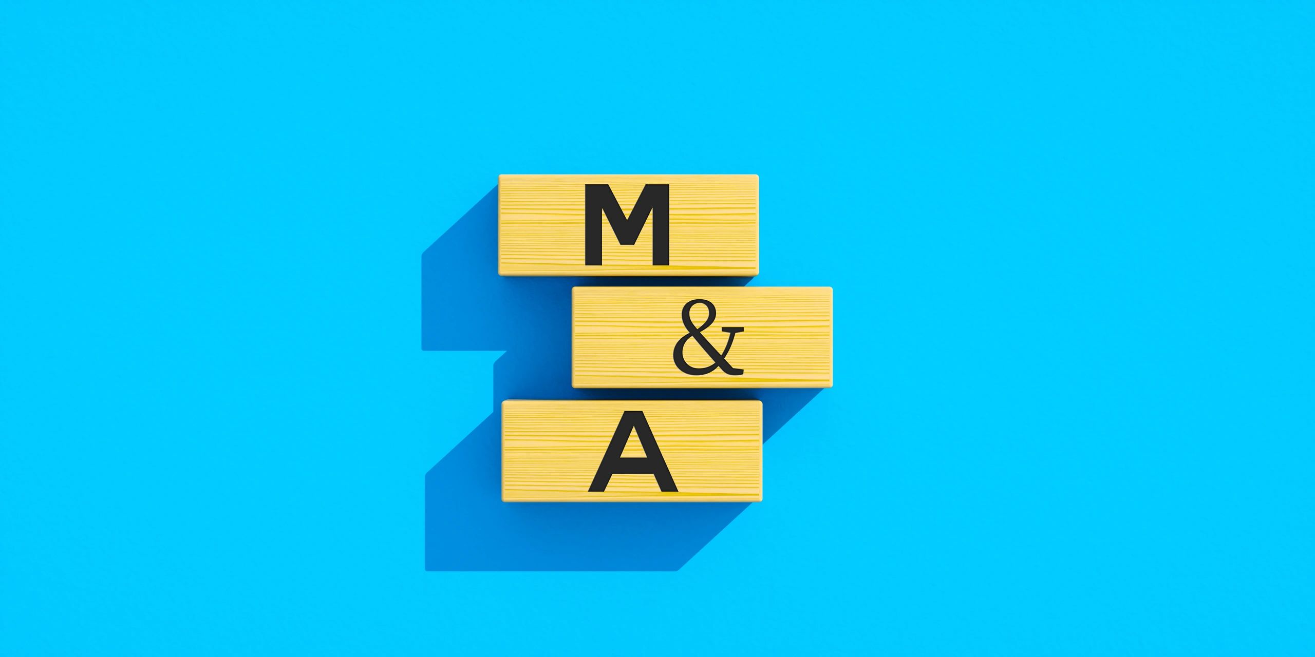 Wooden blocks spelling M&A